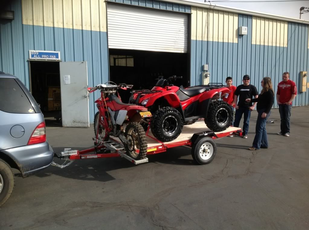 A Harbor Freight 4'x8' folding trailer will hold 3 full size dirt bikes